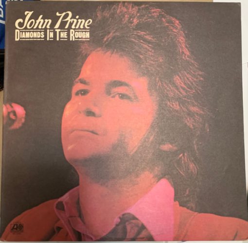 John Prine - Diamonds In The Rough LP NM or M-  [Genre] PROMO 1972 First Pressing w/ Yellow-Black-Red PROMO sticker on bottom left corner on front. Contains lyric sleeve insert and original Atlantic sleeve. Ultrasonic Cleaned for superior sonics!